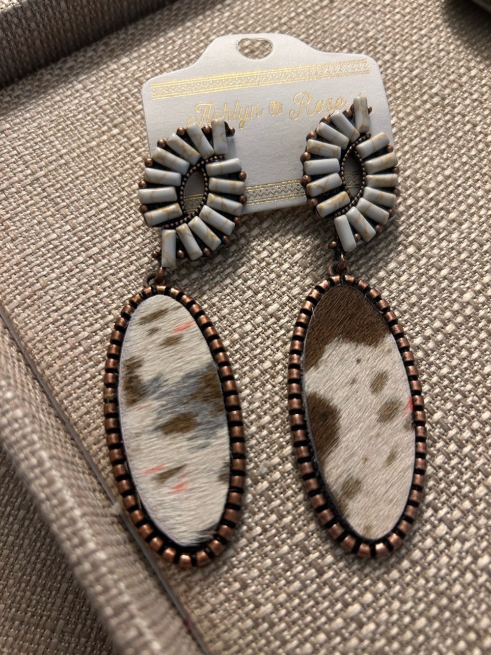 Ashlyn & Rose White Beaded faux Cowhide Drop Earrings